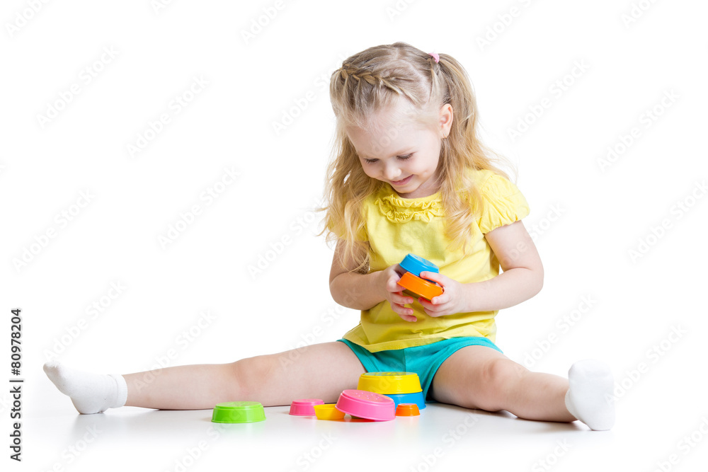 little girl playing on floor at home or kindergarten little girl playing on floor at home or kindergarten