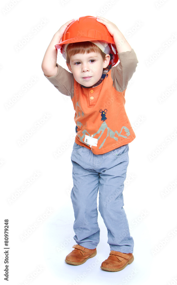 The little boy in the construction helmet. The little boy in the construction helmet.