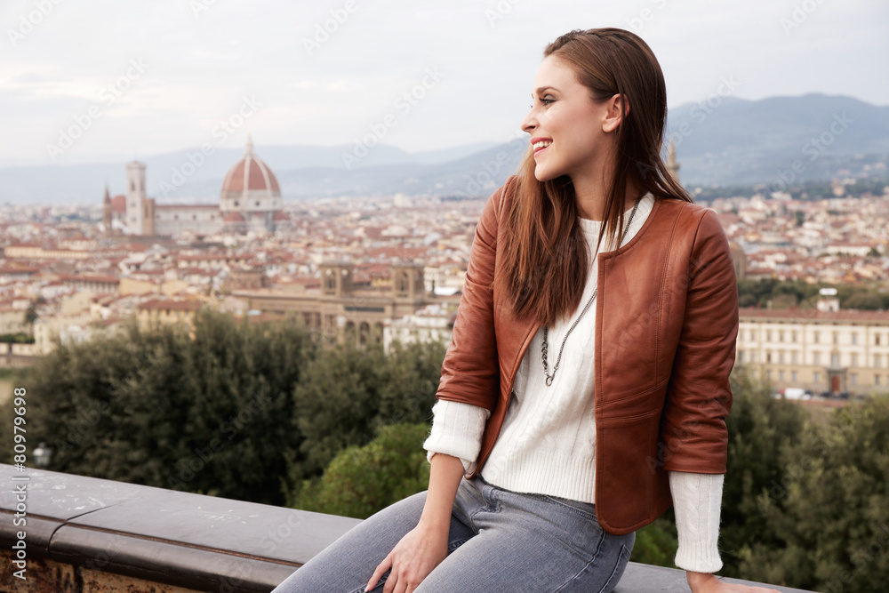 Beautiful girl impressed view the panorama of Florence at sunset