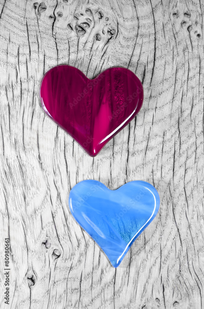 A couple in love - Cherry Red and Blue Glass Heart Symbols. A couple in love - Cherry Red and Blue Glass Heart Symbols.