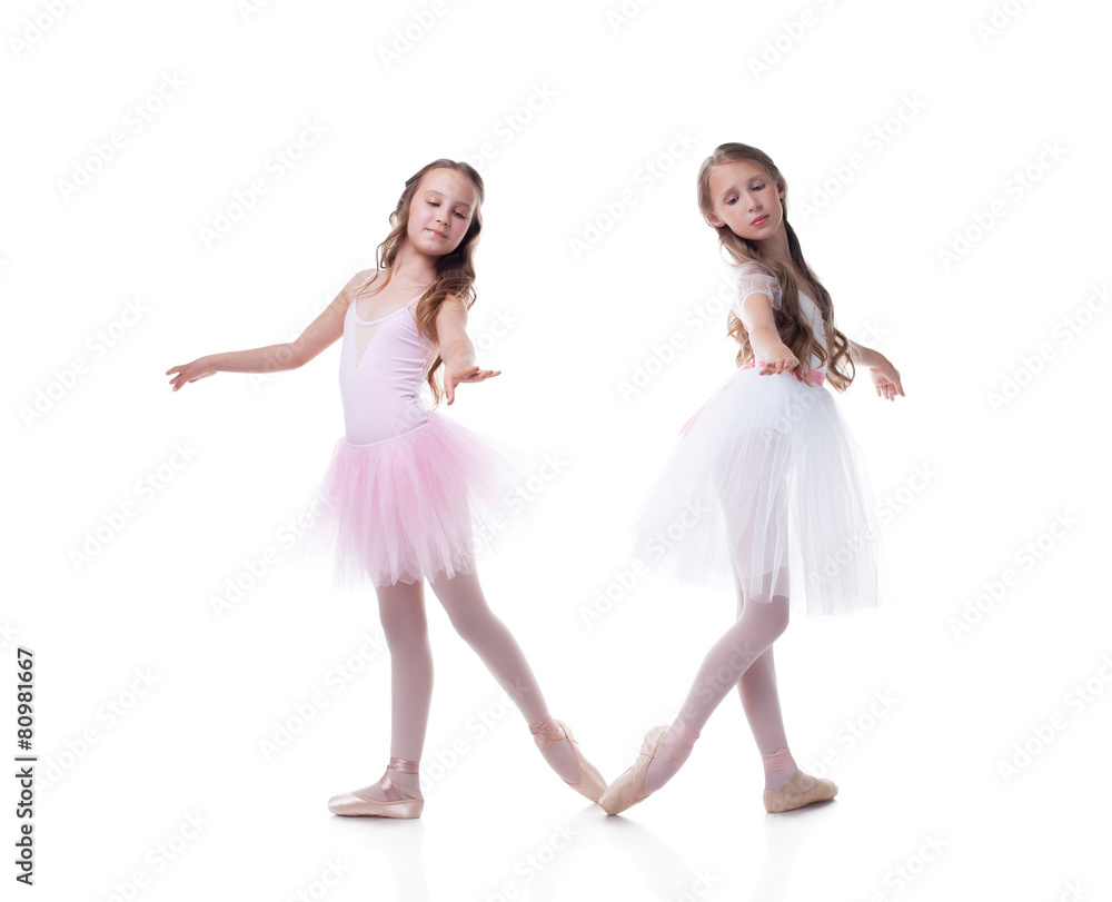 Naklejka premium Cute sisters-ballerinas isolated on white backdrop