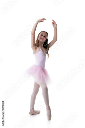 Graceful little ballet dancer isolated on white