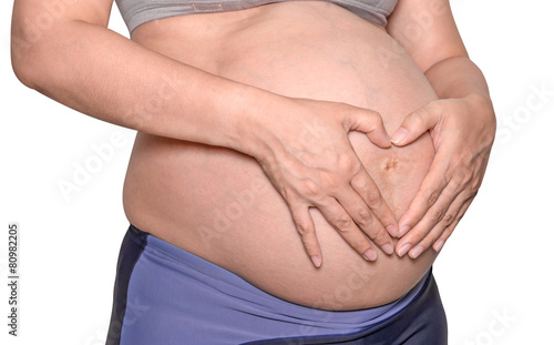 Pregnant woman with hands isolate on white background.