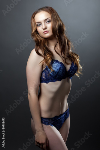 Seductive model posing in blue lingerie
