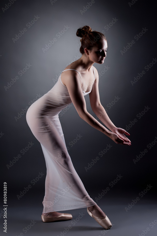 Sexy ballerina dancing in studio, on gray backdrop Stock Photo | Adobe Stock
