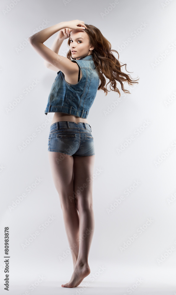 Pretty leggy girl posing looking over her shoulder Pretty leggy girl posing looking over her shoulder
