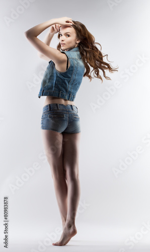 Pretty leggy girl posing looking over her shoulder © Wisky