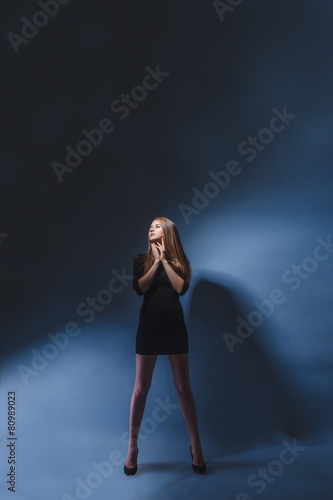 European appearance blonde girl with glasses in black dress legs © maxximmm