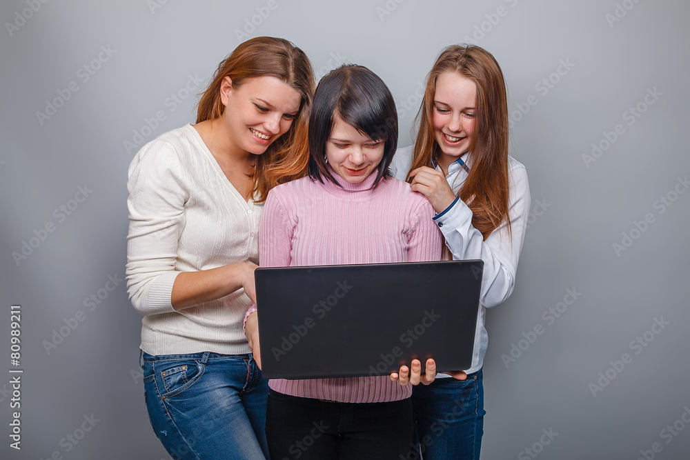 Three girls looking European appearance in computer laughing on Three girls looking European appearance in computer laughing on