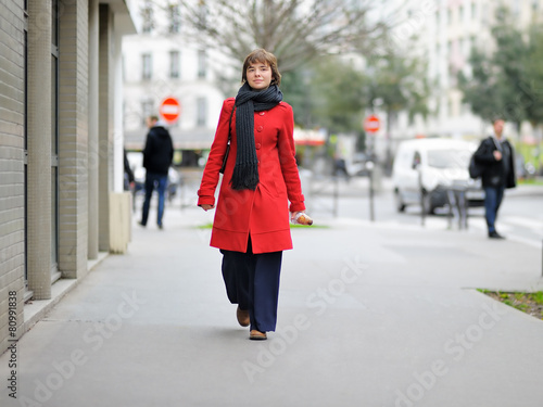 Stylish girl walking on a Paris
