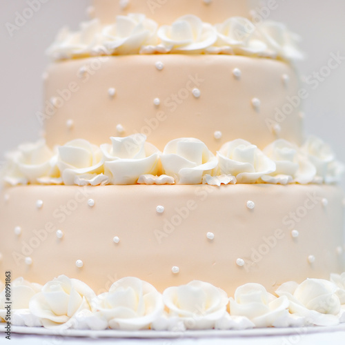 Delicious peach and white wedding cake