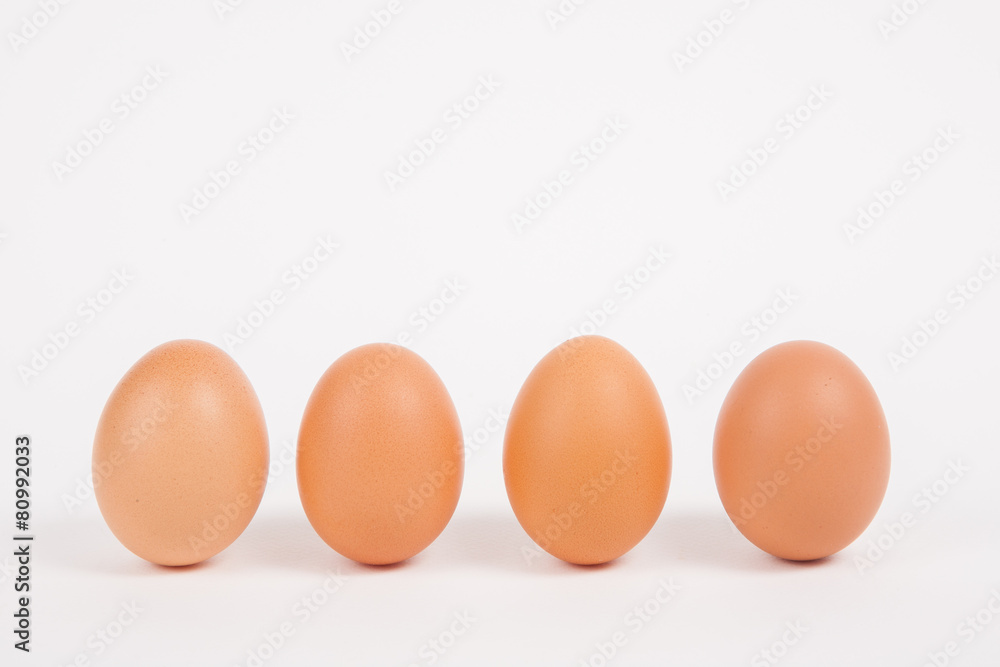 Chicken eggs on white paper background Chicken eggs on white paper background