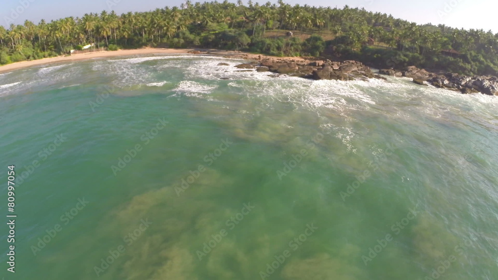 flying over sea waves on tropical beach flying over sea waves on tropical beach