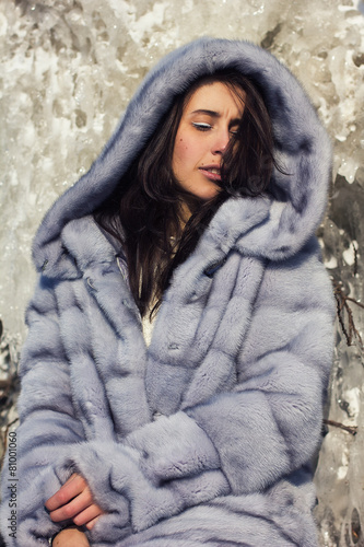 winter portrait of a girl in a fur coat