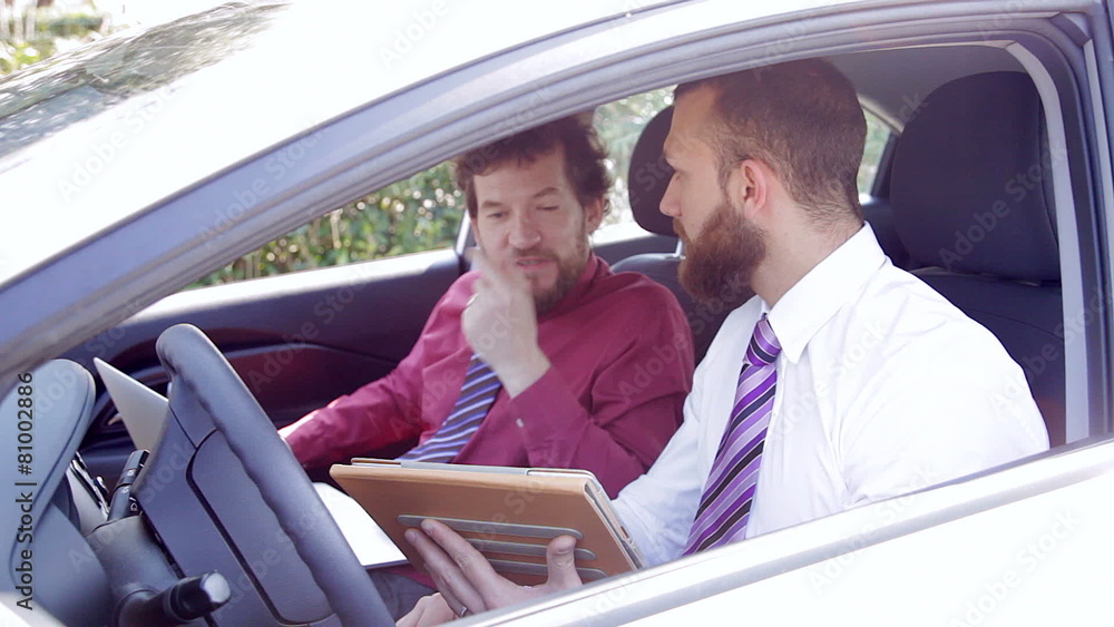 Cool business men working in car with tablet Cool business men working in car with tablet