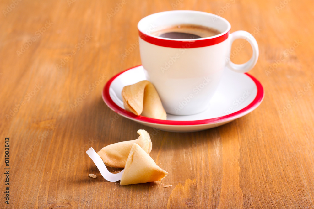 Obraz premium Cup of coffee and fortune cookie