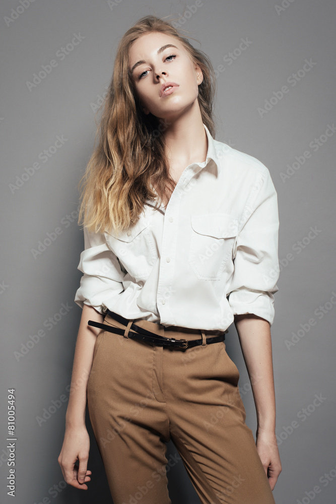 Portrait of a beautiful blonde woman in a white shirt Portrait of a beautiful blonde woman in a white shirt