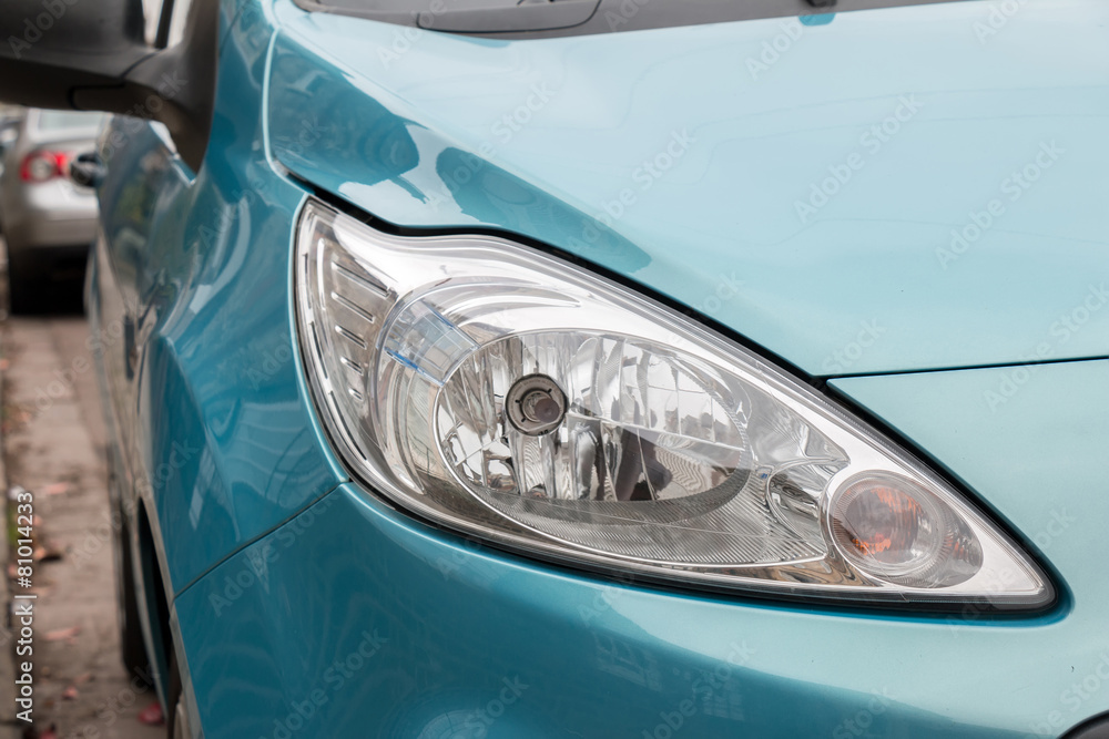 Front Light of Turquoise Car