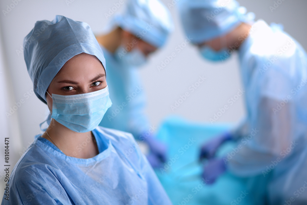 Team surgeon at work in operating room. Team surgeon at work in operating room.
