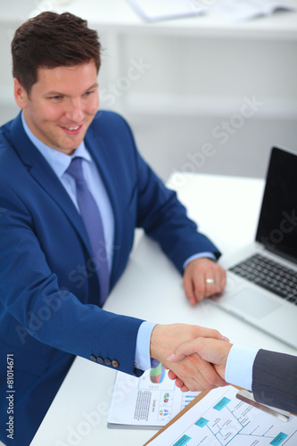 Business people shaking hands, finishing up a meeting