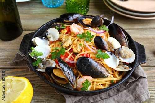 Pasta with seafood and lemon in a frying pan