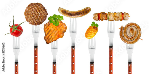 grilled meat on forks