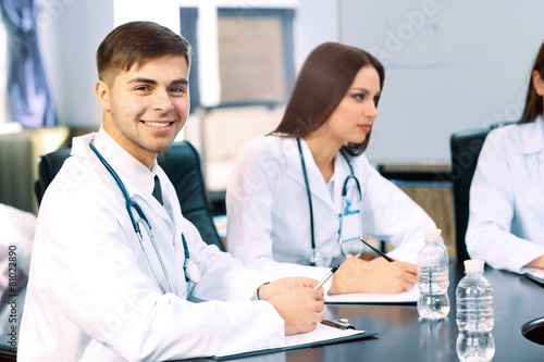 Medical workers working in conference room