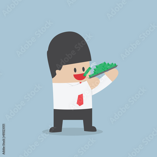 Businessman eating dollars, Corruption and greed concept