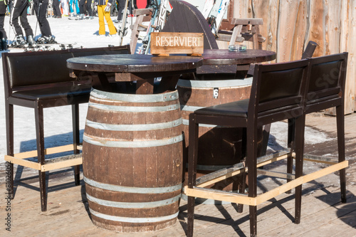 Reserved barrel shaped table in mountain chalet © GioRez