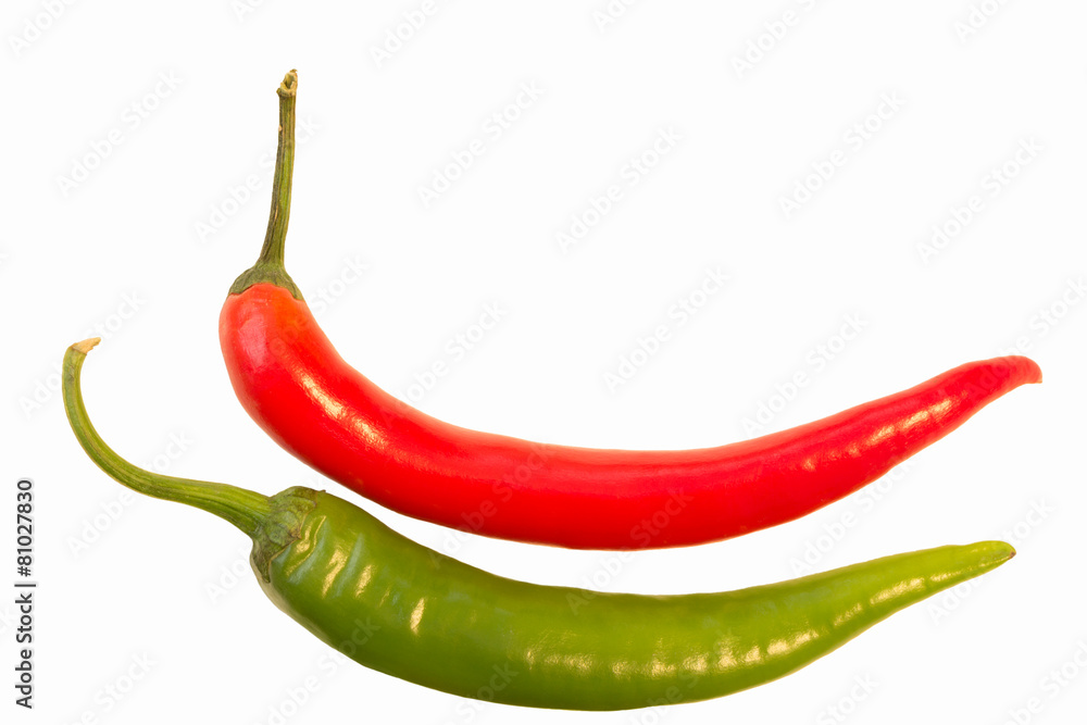 Closeup of a whole red and green chili isolated on white Closeup of a whole red and green chili isolated on white