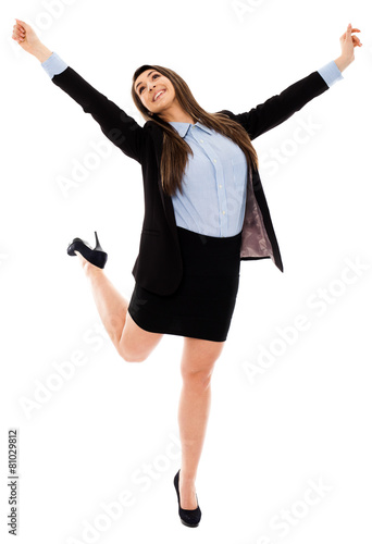 Successful businesswoman jumping for joy