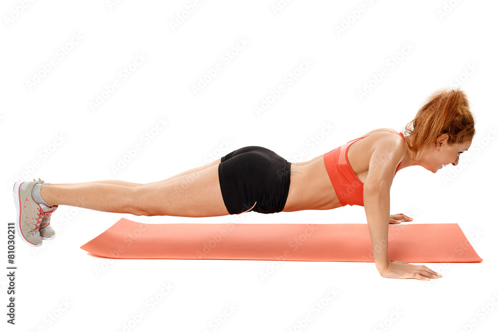 Woman doing exercises on a mat Woman doing exercises on a mat