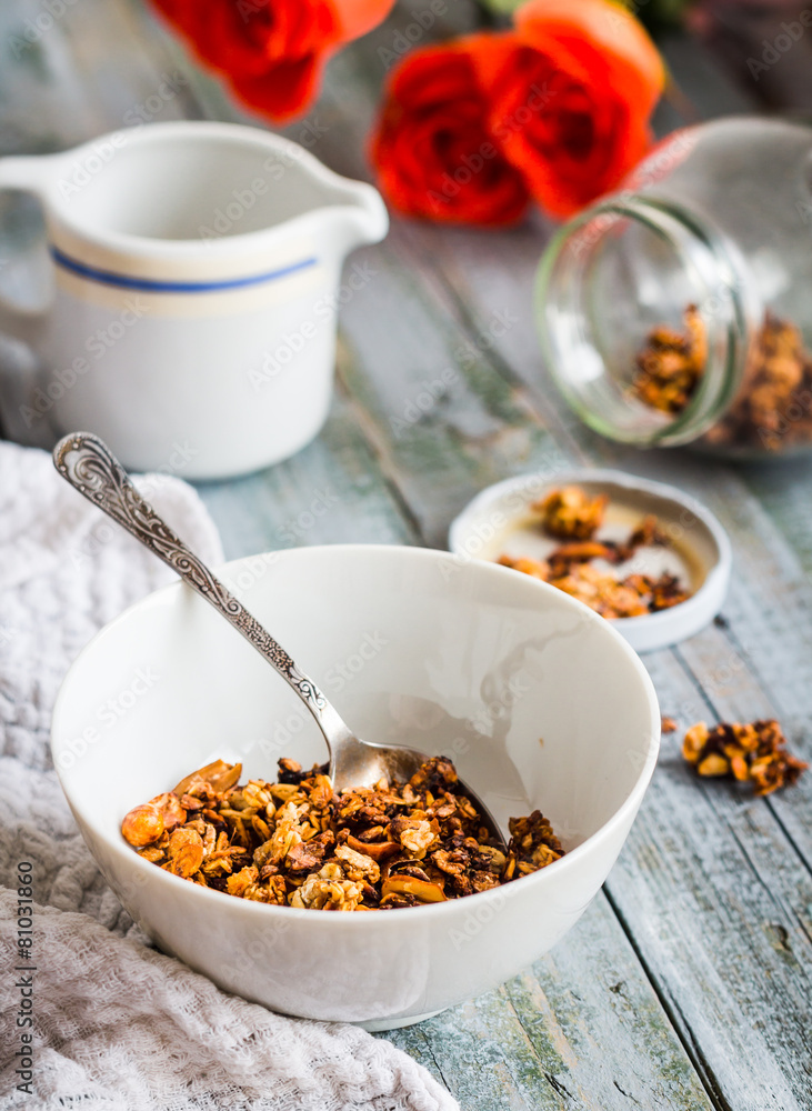 homemade granola with nuts and dried fruit, honey, flowers homemade granola with nuts and dried fruit, honey, flowers