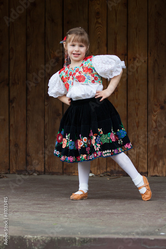 Dancing little girl acting on the stage