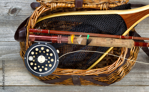 Creel filled with trout fishing equipment