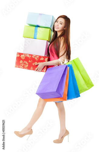 young woman with shopping bags and gift box