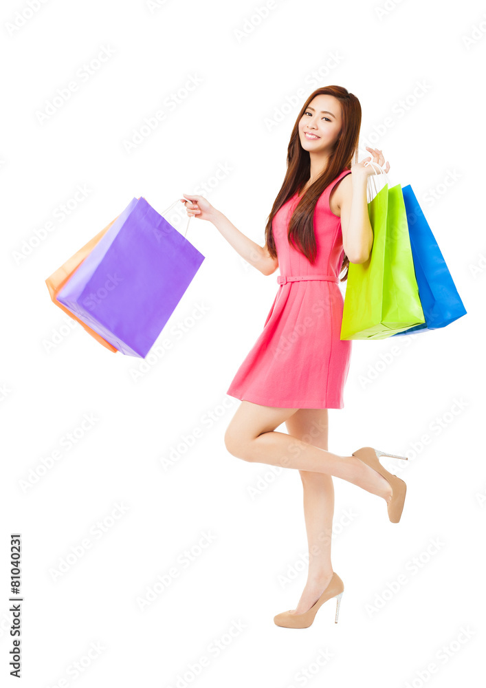young woman with shopping bags isolated on white