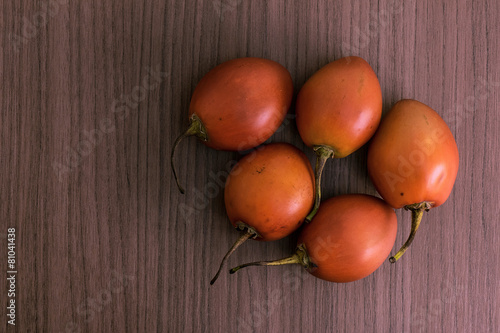 Tamarillo on wood photo