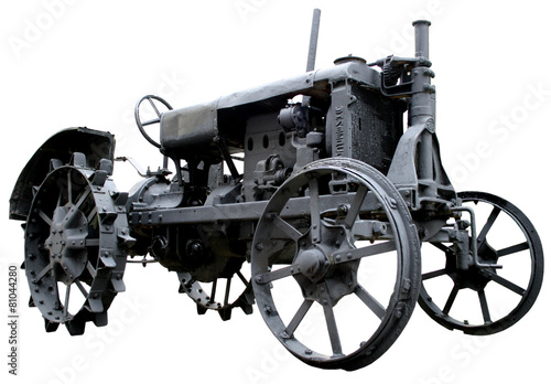isolated rusty obsolete vintage tractor on white background