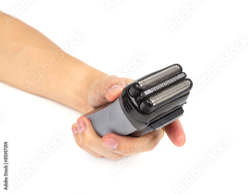 hand with electric shaver