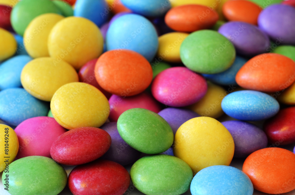Macro detail of pile of colored smarties Macro detail of pile of colored smarties