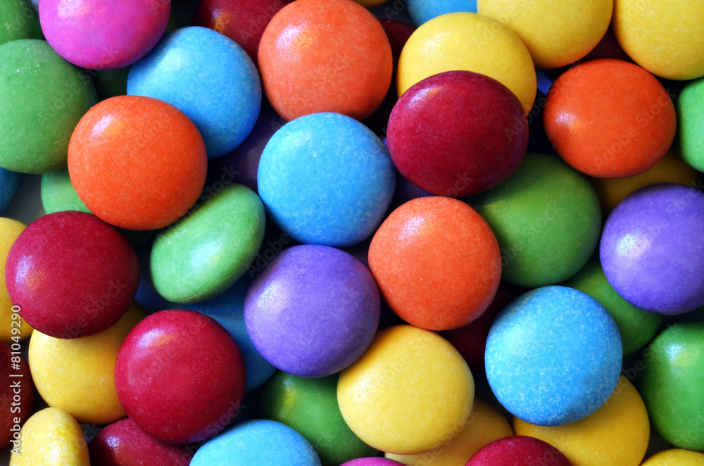 Macro detail of pile of colored smarties Macro detail of pile of colored smarties