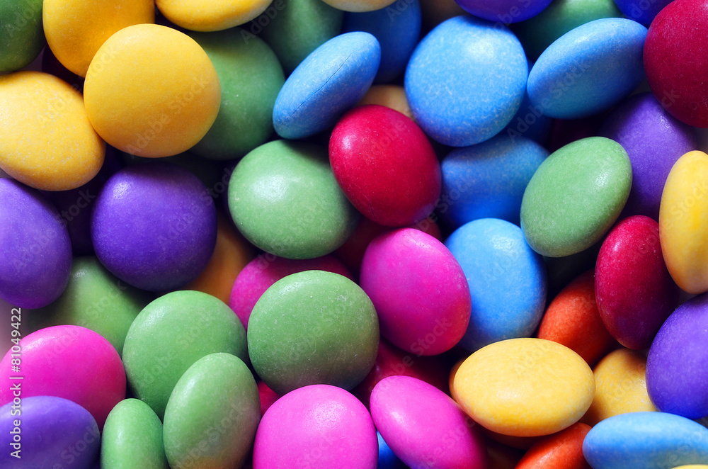 Macro detail of pile of colored smarties Macro detail of pile of colored smarties