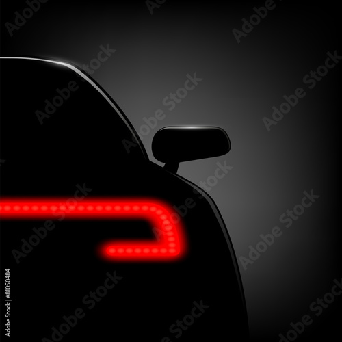 Car silhouette on a black background.