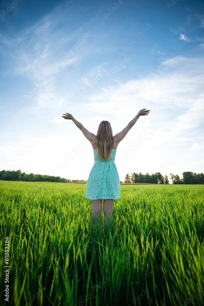 Happiness woman stay outdoor under sunlight of sunset Happiness woman stay outdoor under sunlight of sunset