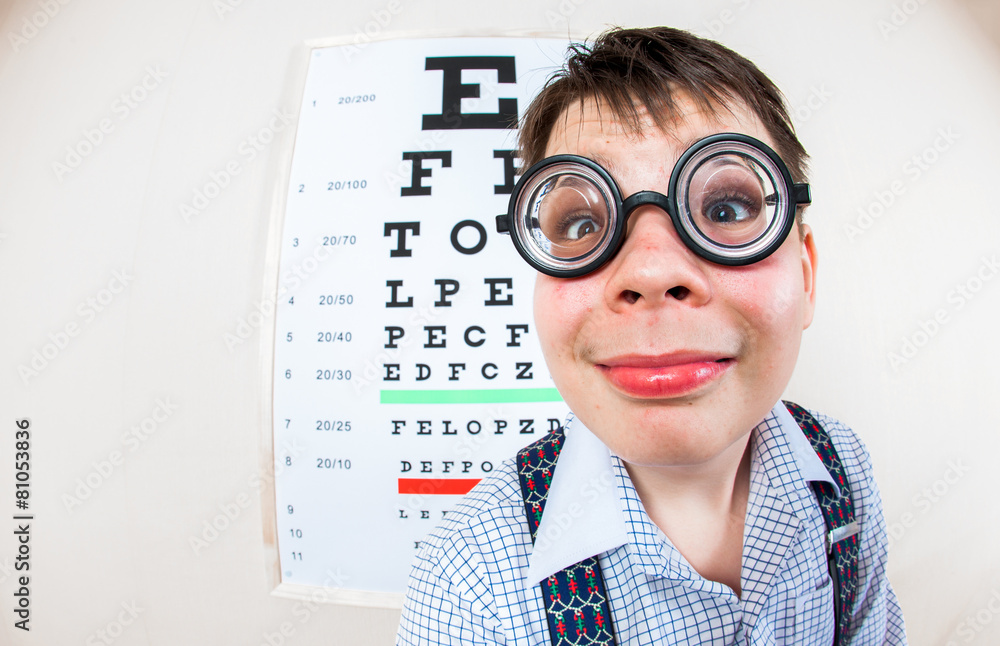 Person wearing spectacles in an office at the doctor Person wearing spectacles in an office at the doctor