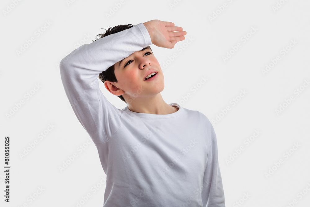 Hispanic smooth-skinned boy holding his arm on the front