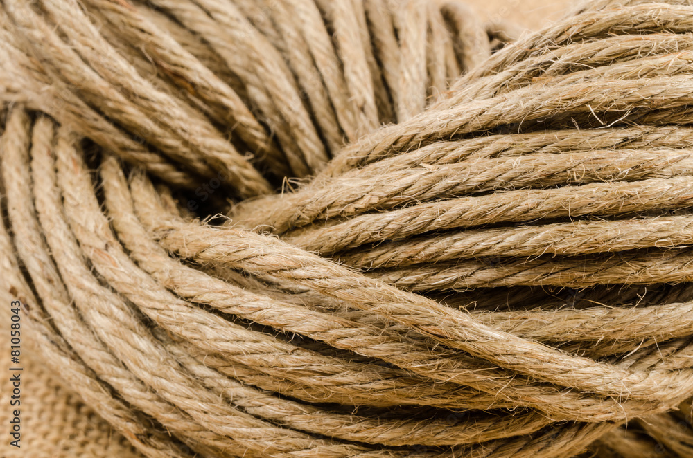 close up roll of rope on sack cloth,burlap