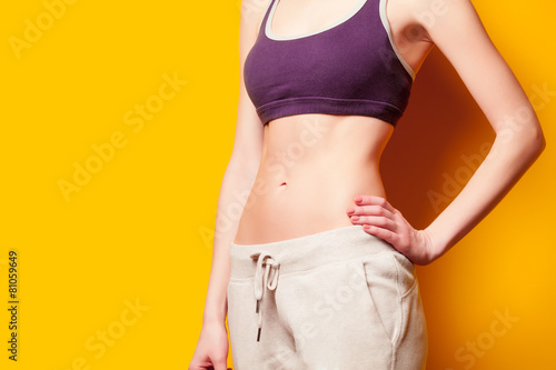 Woman showing her abs after weight loss