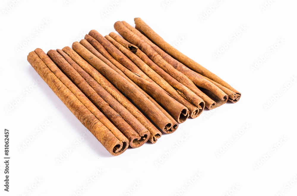 Row of stick cinnamon isolated on white background Row of stick cinnamon isolated on white background